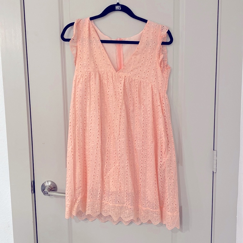 Light pink dress with shorts and pockets. Never worn.